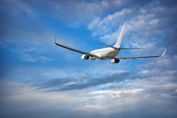 istock Aircraft is flying in blue cloudy sky 1125645947