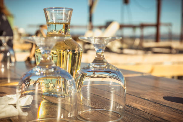 istock carafe of white wine with wine glasses 1125646495
