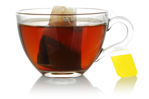 istock Tea in a glass cup on white background 1125647662