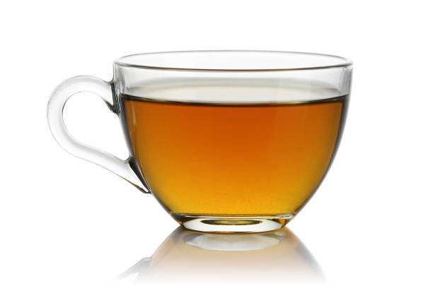 istock Tea in a glass cup on white background 1125648083