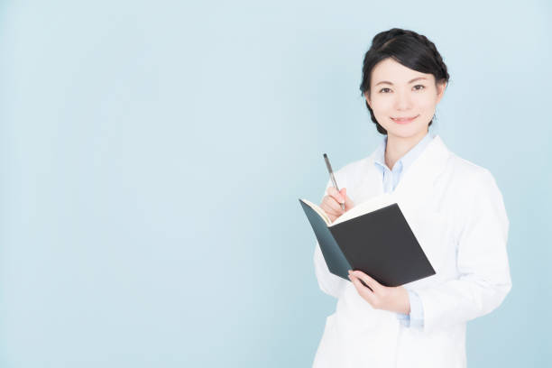 istock woman wearing white coat 1125652953