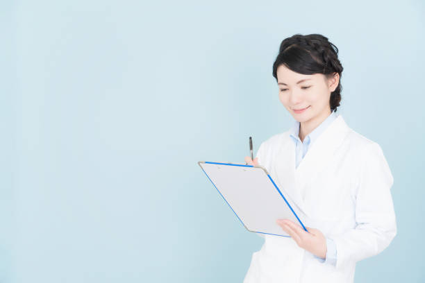 istock woman wearing white coat 1125653192