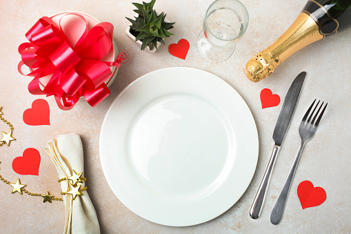 Plate served with fork and knife and Christmas decoration