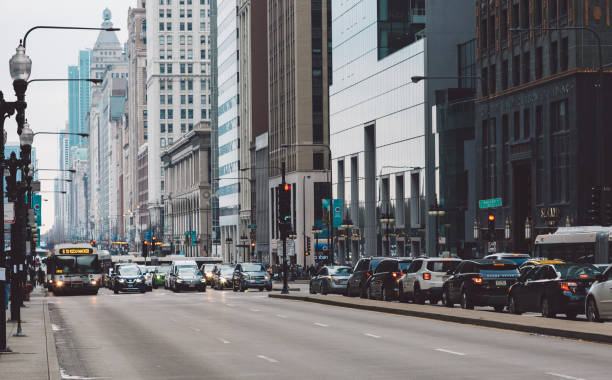 istock Traffic On Road By Buildings In City 1125655751