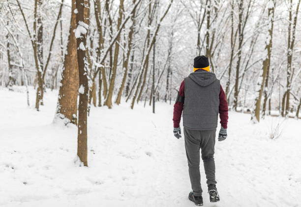 istock Senior man jogging in snow 1125656116
