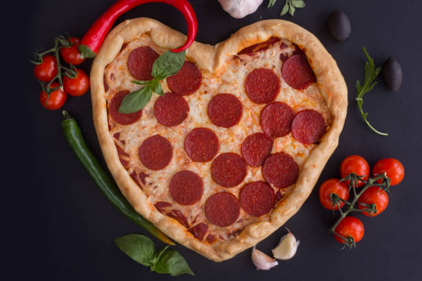 istock Pizza heart shaped with pepperoni 1125657260