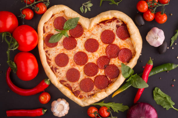 istock Pizza heart shaped with pepperoni 1125657293