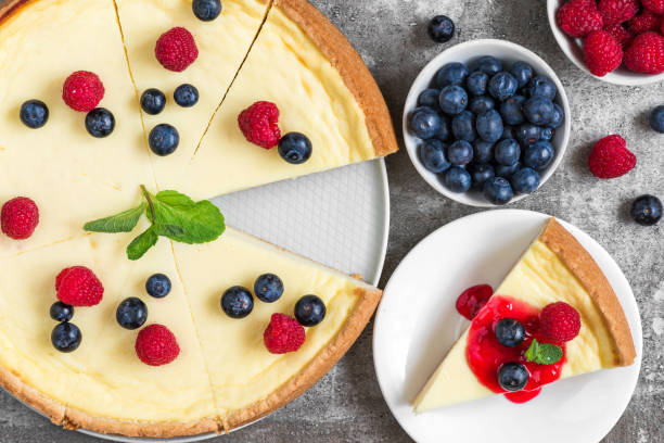 istock Classic sliced cheesecake with jam on stone background, top view 1125657821