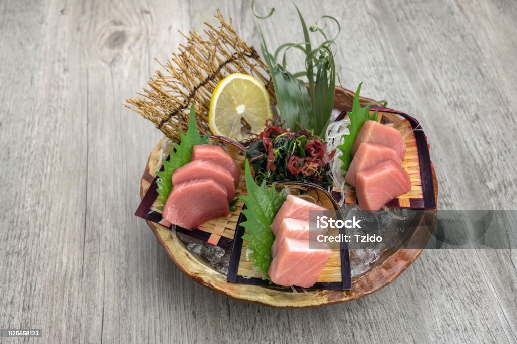 Top view of tuna sashimi set include Otoro, Chutoro and Akami with ice on the table, Luxury Japanese food concept Opah Stock Photo
