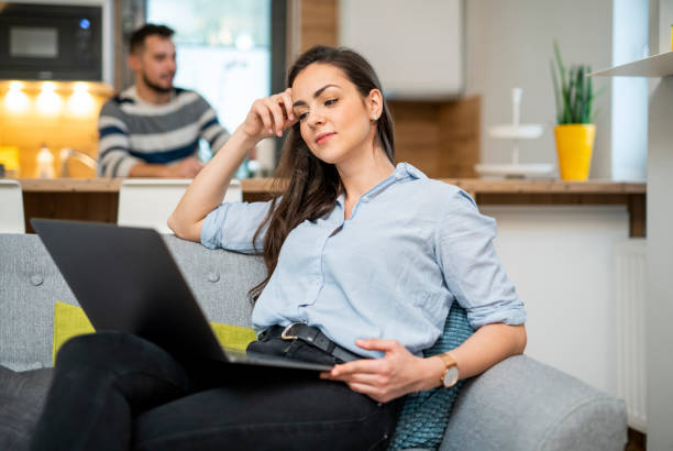 istock Young woman working at home and using laptop 1125659992