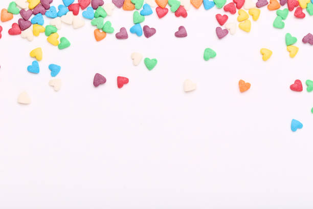 istock Colorful heart shaped sprinkles on white background 1125661398