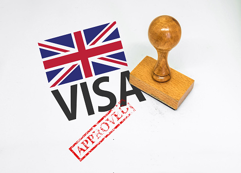 United Kingdom Visa Approved with Rubber Stamp and flag