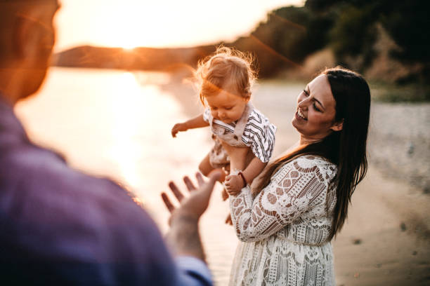istock Family enjoying beach 1125666938