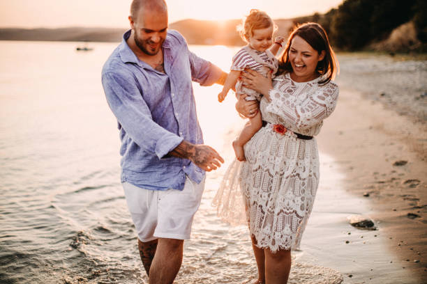 istock Family enjoying beach 1125667394