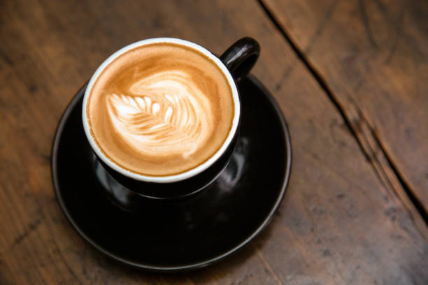 istock Cup of coffee on wooden table 1125667582