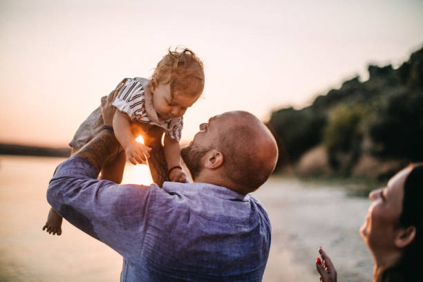istock Family enjoying beach 1125669699
