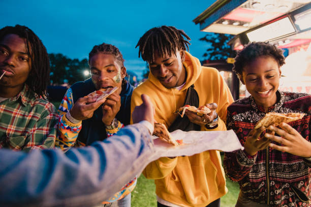 istock Friends Sharing Pizza at Festival 1125671385