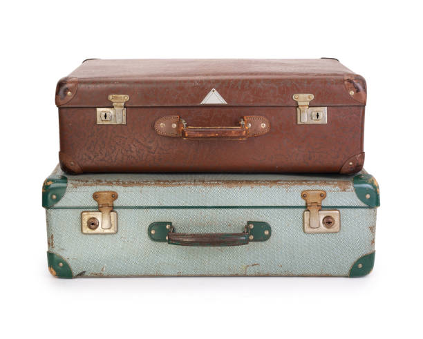 istock Two old vintage suitcases on white background, contains clipping path 1125671564