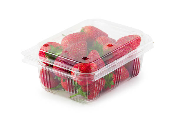 istock Fresh strawberries in a clear plastic box isolated over a white background 1125674806
