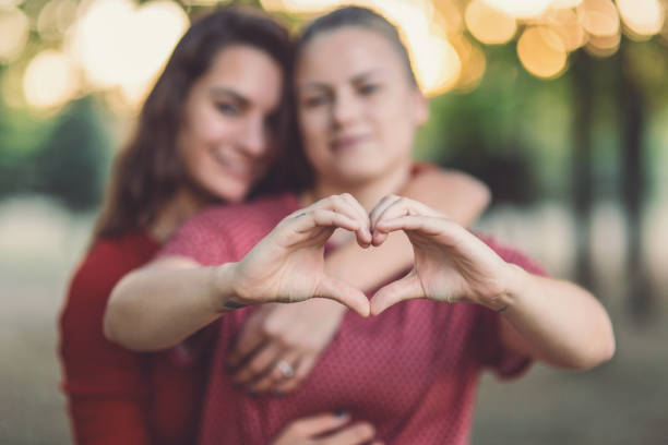 istock Lovely female couple looking at camera 1125674900