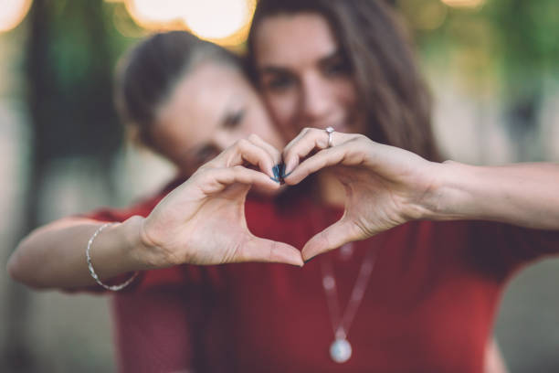 istock Heart shaped with female hands 1125674906