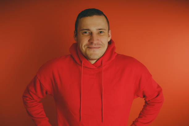 istock Crazy and charismatic guy posing on an orange background. 1125676421