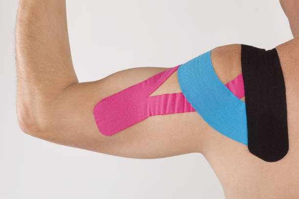 istock Physiotherapy tape on mans shoulder. 1125677072