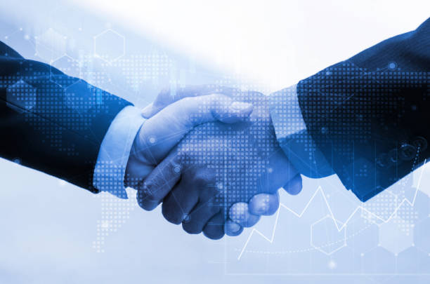 istock business man handshake with effect global world map network link connection and graph chart of stock market graphic diagram, digital technology, internet communication, teamwork, partnership concept 1125677364