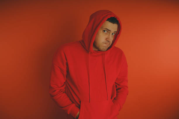istock Crazy and charismatic guy posing on an orange background. 1125677683