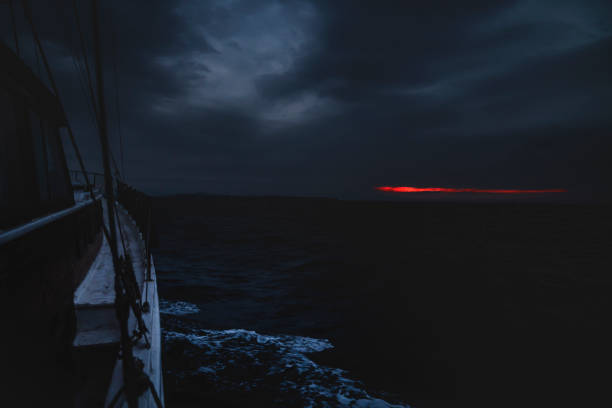 Fishing boat at sea, at sunrise