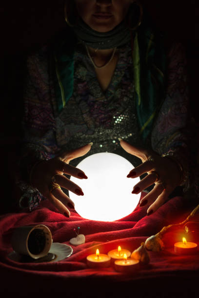 istock Hands from gypsy fortune teller above magic crystal ball 1125680613