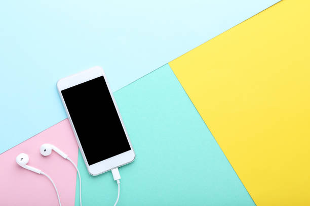 istock Smartphone with earphones on colorful background 1125680671