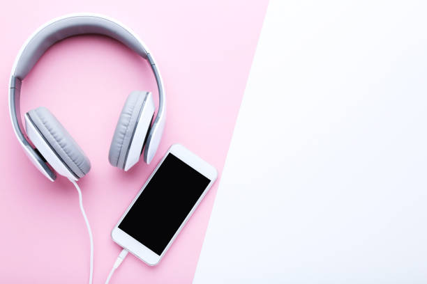 istock Smartphone with headphones on colorful background 1125681725