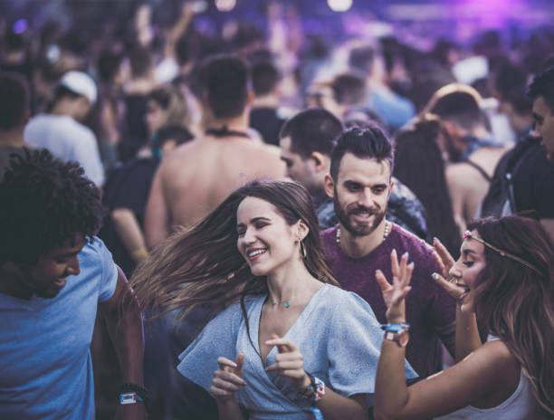 istock Happy couples having fun while dancing on music concert. 1125681805