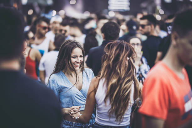 istock Young happy women having fun while dancing on a music concert. 1125682014