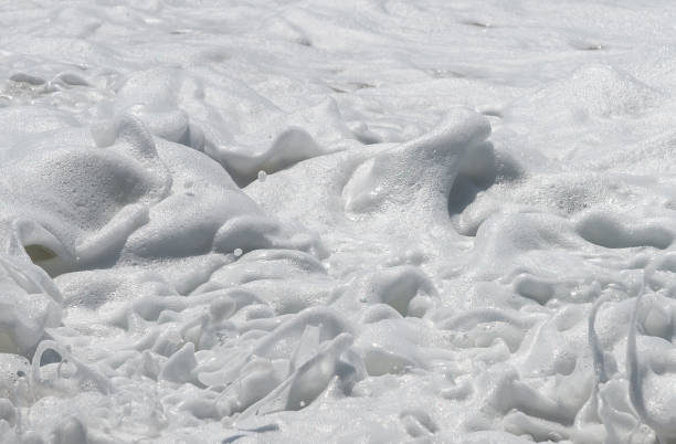 istock waves with white foam of the sea 1125682103