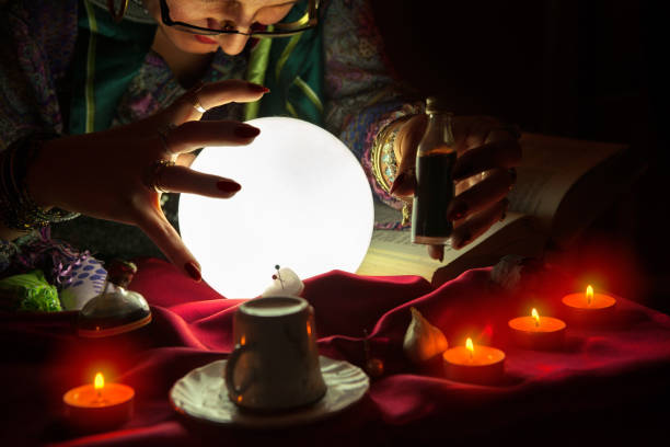istock Fortune teller woman staring at crystal ball 1125682271