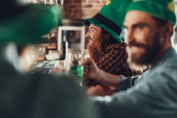 istock Joyful young man celebrating Saint Patrick Day with friends 1125684205