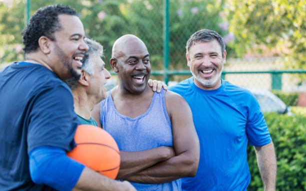 istock Multi-ethnic group of middle aged men playing basketball 1125685154