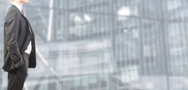 istock Business man in suit on isolated blurred and spacious background 1125685361
