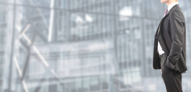 istock Business man in suit on isolated blurred and spacious background 1125685376