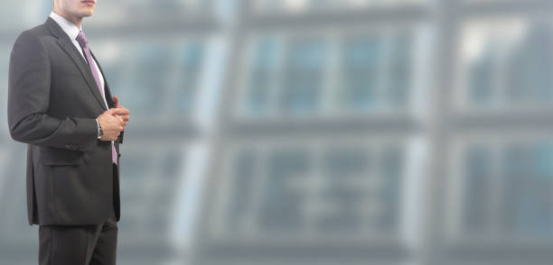 istock Business man in suit on isolated blurred and spacious background 1125685421