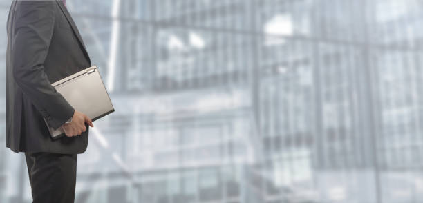 istock Businessman with folders isolated on blurred and spacious background 1125685444