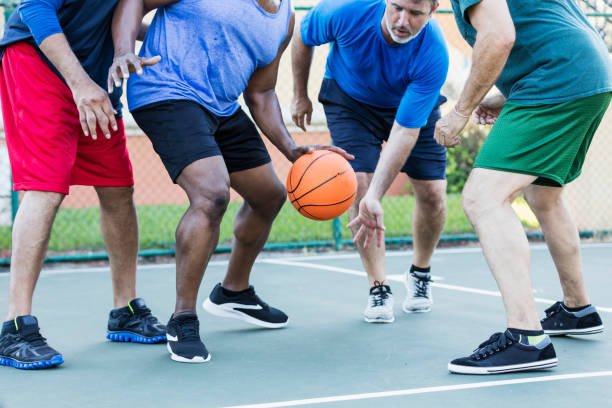 istock Mature men having fun playing basketball 1125687511