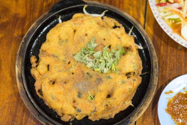 istock Crispy Thai Mussel Omelet served on hot pan, top view 1125687789