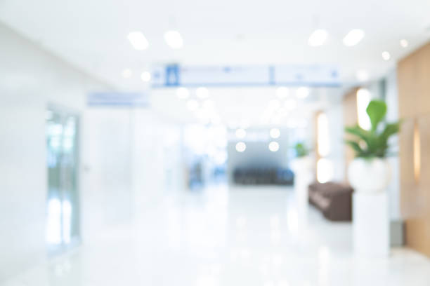 Abstract blur luxury hospital corridor. Blur clinic interior background with defocused effect. Healthcare and medical concept Abstract blur luxury hospital corridor. Blur clinic interior background with defocused effect. Healthcare and medical concept medical examination room stock pictures, royalty-free photos & images