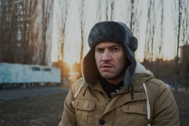 istock Happy handsome young man in cap with earflaps. 1125688424