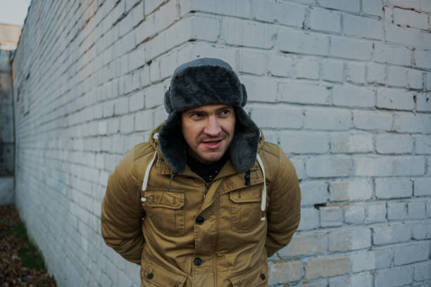 istock Happy handsome young man in cap with earflaps. 1125688503
