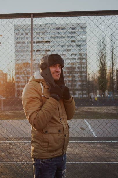 istock Happy handsome young man in cap with earflaps. 1125688648