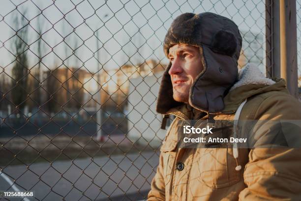 Happy Handsome Young Man In Cap With Earflaps Stock Photo - Download Image Now - Adult, Adults Only, Beautiful People